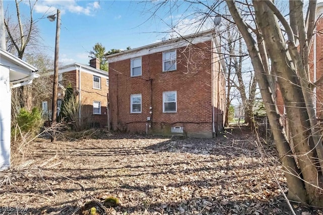 17809 Harvard Ave, Cleveland, OH 44128 - back of property with brick siding and crawl space