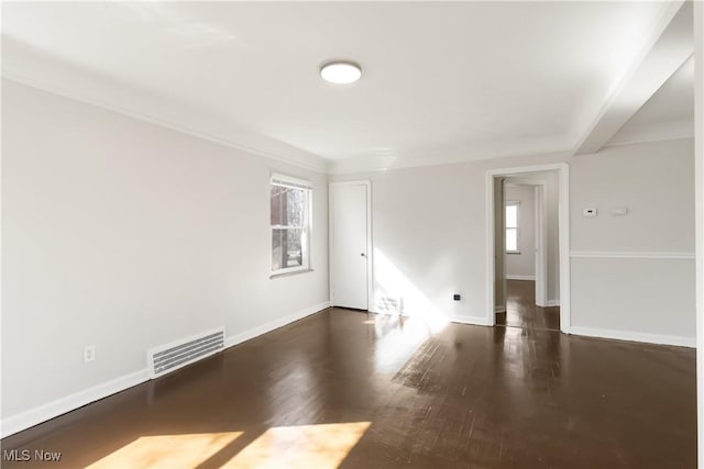 17809 Harvard Ave, Cleveland, OH 44128 - spare room with baseboards, visible vents, and wood finished floors