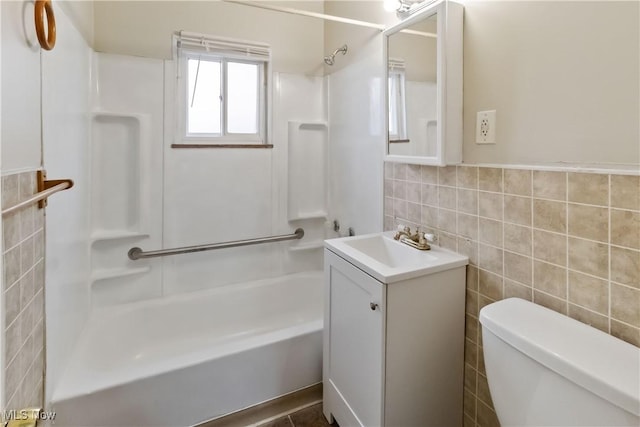 17809 Harvard Ave, Cleveland, OH 44128 - full bathroom with shower / bathing tub combination, vanity, toilet, and tile walls