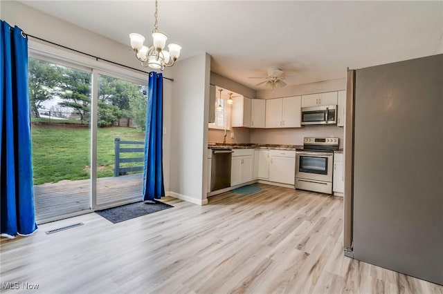 44 Hickory Dr, Little Hocking, OH 45742 - kitchen with visible vents, light wood finished floors, stainless steel appliances, white cabinetry, and a sink