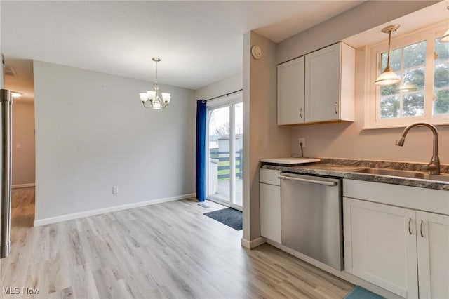 44 Hickory Dr, Little Hocking, OH 45742 - kitchen with baseboards, a sink, light wood-type flooring, hanging light fixtures, and stainless steel dishwasher