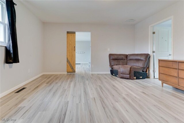 44 Hickory Dr, Little Hocking, OH 45742 - living area featuring baseboards, light wood-style floors, and visible vents