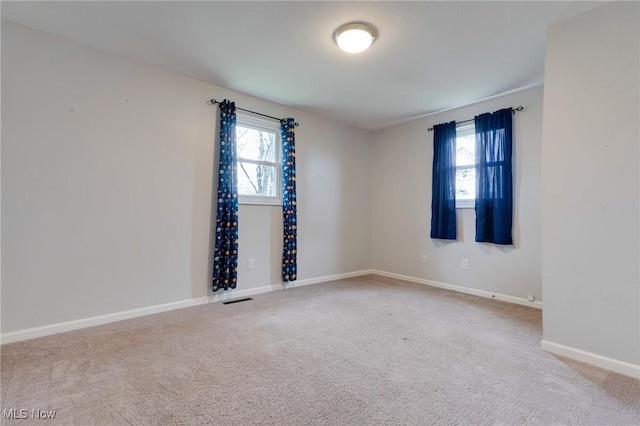 44 Hickory Dr, Little Hocking, OH 45742 - carpeted spare room with baseboards, a healthy amount of sunlight, and visible vents