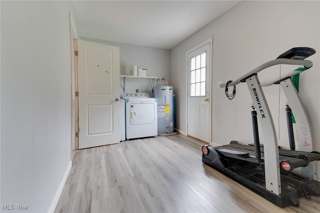 44 Hickory Dr, Little Hocking, OH 45742 - laundry area with separate washer and dryer, wood finished floors, laundry area, baseboards, and electric water heater