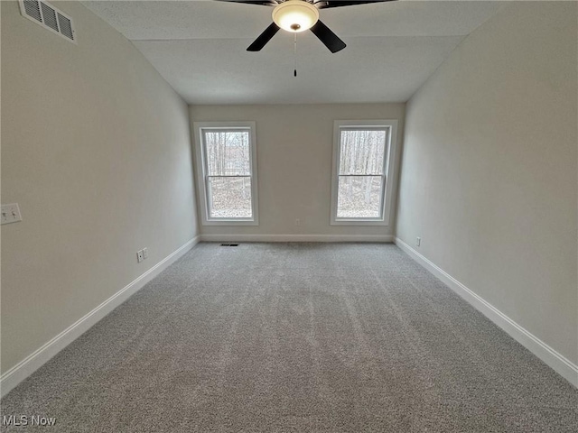 32062 Tuscan Ln Unit L-4, Avon Lake, OH 44012 - unfurnished room with baseboards, carpet floors, ceiling fan, and visible vents