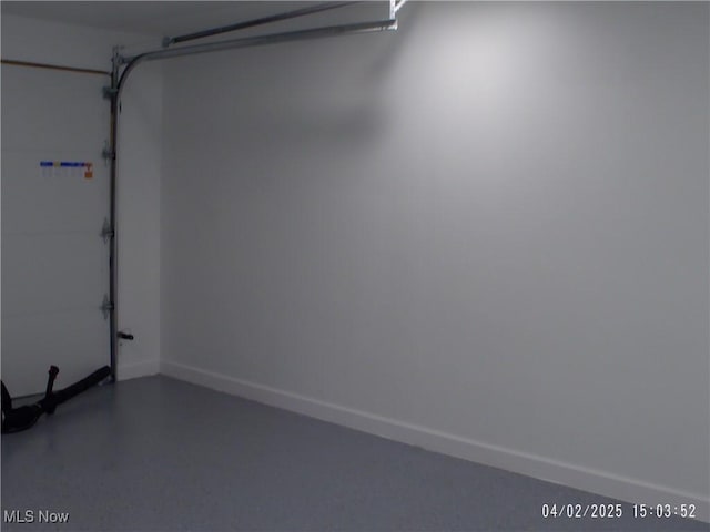 garage featuring baseboards