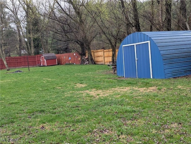 44790 County Road 23, Coshocton, OH 43812 - view of yard with a storage unit, a fenced backyard, and an outdoor structure