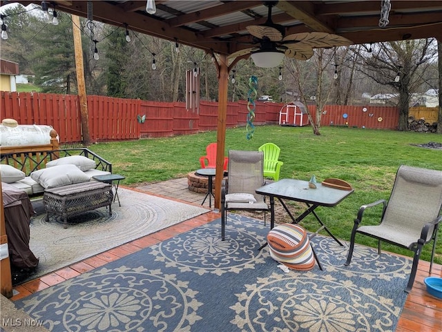 44790 County Road 23, Coshocton, OH 43812 - view of patio with a fenced backyard, an outdoor living space with a fire pit, and a ceiling fan
