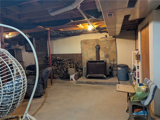 44790 County Road 23, Coshocton, OH 43812 - unfinished basement featuring visible vents and a wood stove