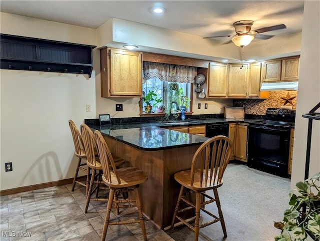 44790 County Road 23, Coshocton, OH 43812 - kitchen featuring a kitchen bar, under cabinet range hood, a sink, a peninsula, and black range with electric stovetop