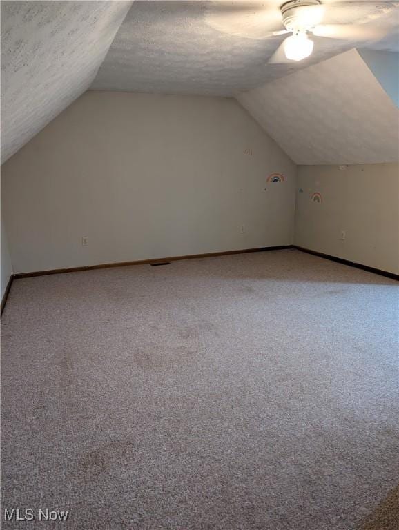 44790 County Road 23, Coshocton, OH 43812 - additional living space with baseboards, a textured ceiling, ceiling fan, and light carpet