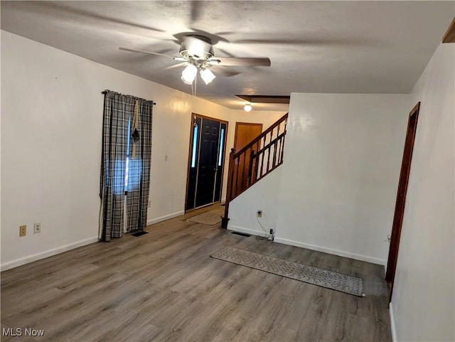 44790 County Road 23, Coshocton, OH 43812 - entryway featuring baseboards, wood finished floors, ceiling fan, and stairway