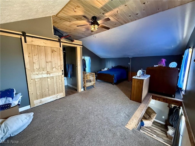 bedroom featuring carpet, baseboards, a barn door, vaulted ceiling, and wooden ceiling