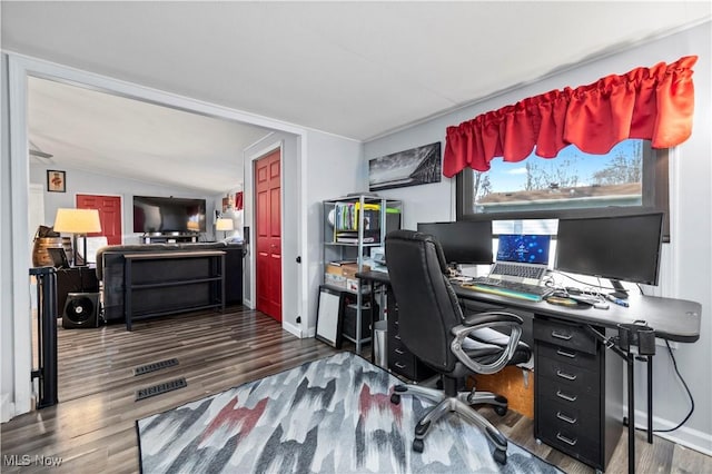 home office with baseboards, vaulted ceiling, and wood finished floors