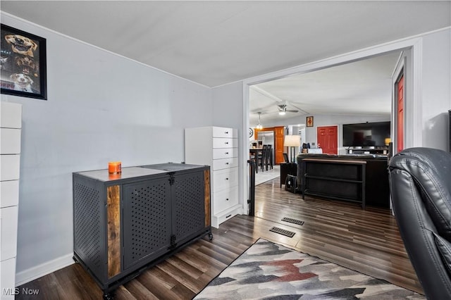office space featuring baseboards, dark wood-style flooring, ceiling fan, and lofted ceiling