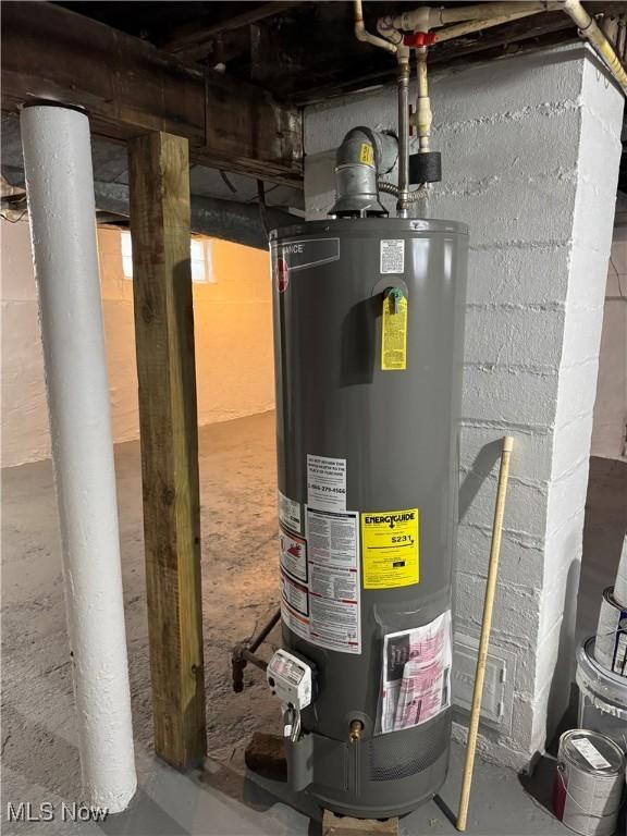 utility room featuring gas water heater