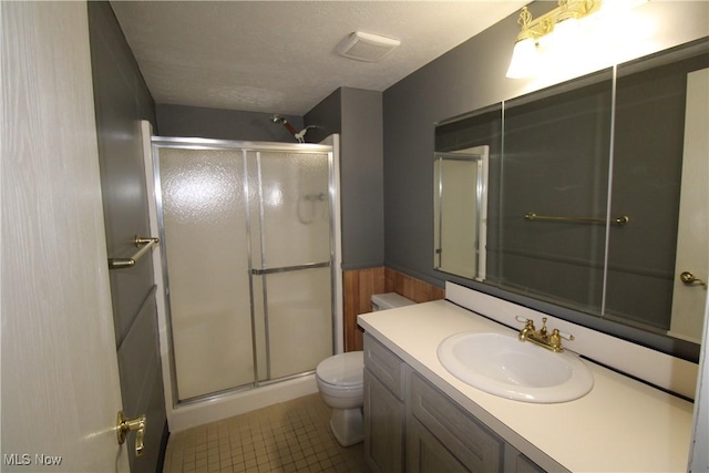 7073 Bristlewood Dr, Concord, OH 44077 - bathroom featuring toilet, a stall shower, vanity, and tile patterned floors