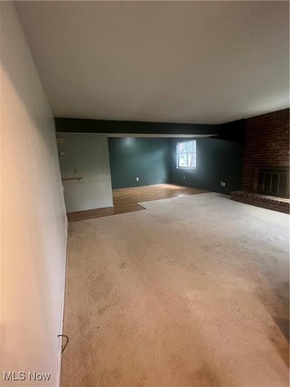 7073 Bristlewood Dr, Concord, OH 44077 - empty room with carpet flooring and a fireplace