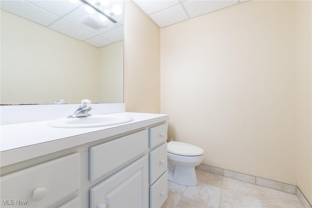 2 Salem Ct, Beachwood, OH 44122 - half bath featuring a paneled ceiling, vanity, toilet, and baseboards