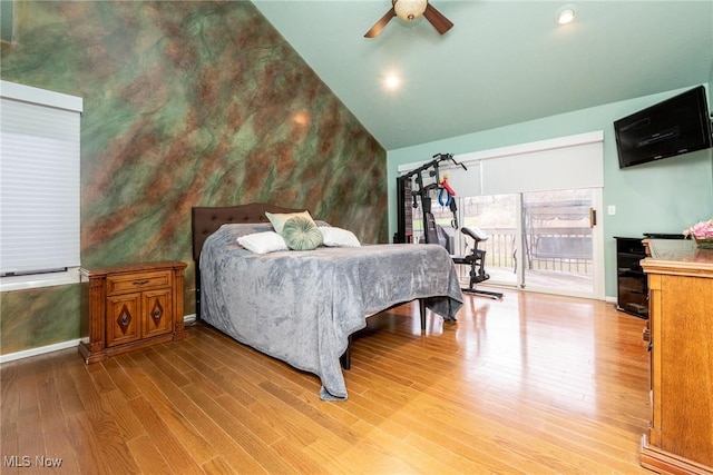 bedroom featuring wood finished floors, baseboards, ceiling fan, access to outside, and vaulted ceiling