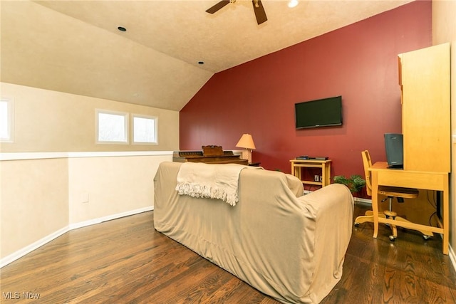living room featuring baseboards, ceiling fan, wood finished floors, and lofted ceiling