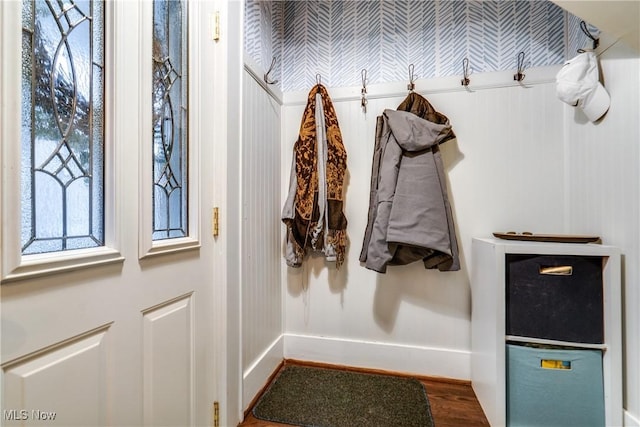 mudroom with baseboards and wood finished floors