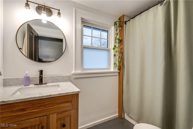 bathroom featuring curtained shower and vanity