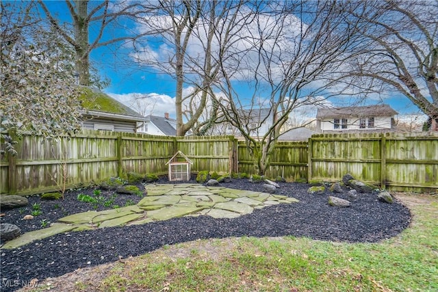 view of yard with a fenced backyard