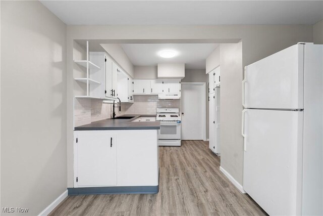 1862 17th St SW, Akron, OH 44314 - kitchen with decorative backsplash, white appliances, under cabinet range hood, a sink, and open shelves