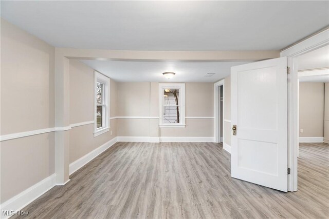 1862 17th St SW, Akron, OH 44314 - empty room with baseboards and light wood finished floors