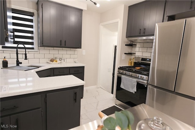 4019 W 226th St, Fairview Park, OH 44126 - kitchen featuring appliances with stainless steel finishes, a sink, light marble finish flooring, under cabinet range hood, and light countertops