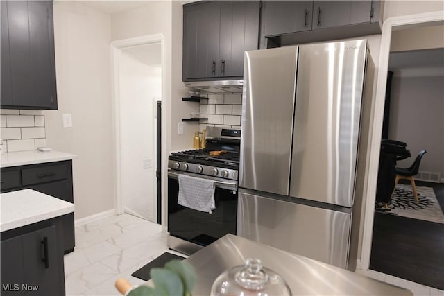 4019 W 226th St, Fairview Park, OH 44126 - kitchen with stainless steel appliances, light marble finish floors, light countertops, gray cabinets, and backsplash