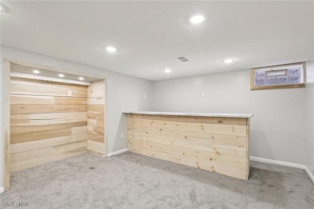 bar with wood walls, recessed lighting, baseboards, carpet floors, and visible vents
