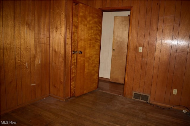 190 10th St, Campbell, OH 44405 - unfurnished room with visible vents, wood finished floors, and wood walls