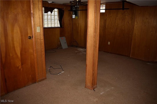 190 10th St, Campbell, OH 44405 - basement featuring ceiling fan and wood walls