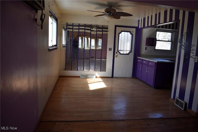 190 10th St, Campbell, OH 44405 - kitchen featuring visible vents, wood finished floors, and ceiling fan