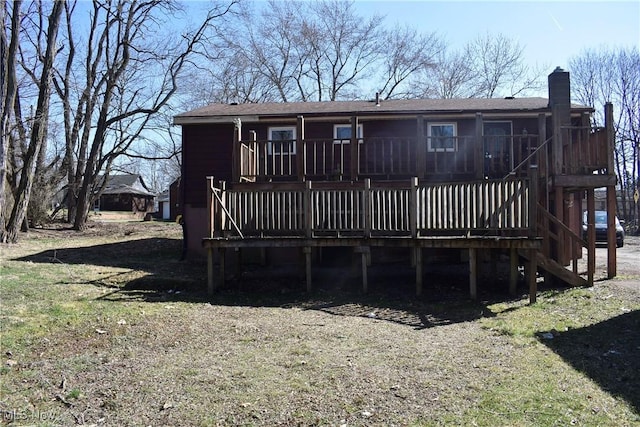 190 10th St, Campbell, OH 44405 - back of house featuring a chimney, a wooden deck, and stairway