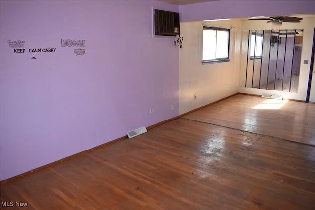 190 10th St, Campbell, OH 44405 - unfurnished room with a ceiling fan, wood finished floors, baseboards, and visible vents