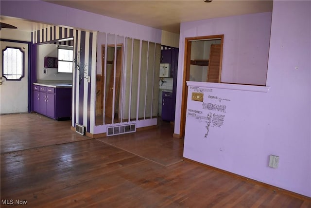 190 10th St, Campbell, OH 44405 - empty room featuring baseboards, visible vents, and wood finished floors
