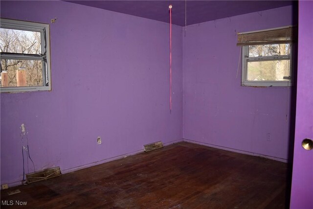190 10th St, Campbell, OH 44405 - spare room with visible vents and wood finished floors