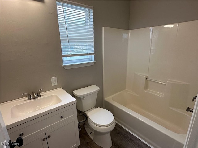 4225 E 93rd St, Cleveland, OH 44105 - full bathroom featuring toilet, vanity, wood finished floors, and washtub / shower combination