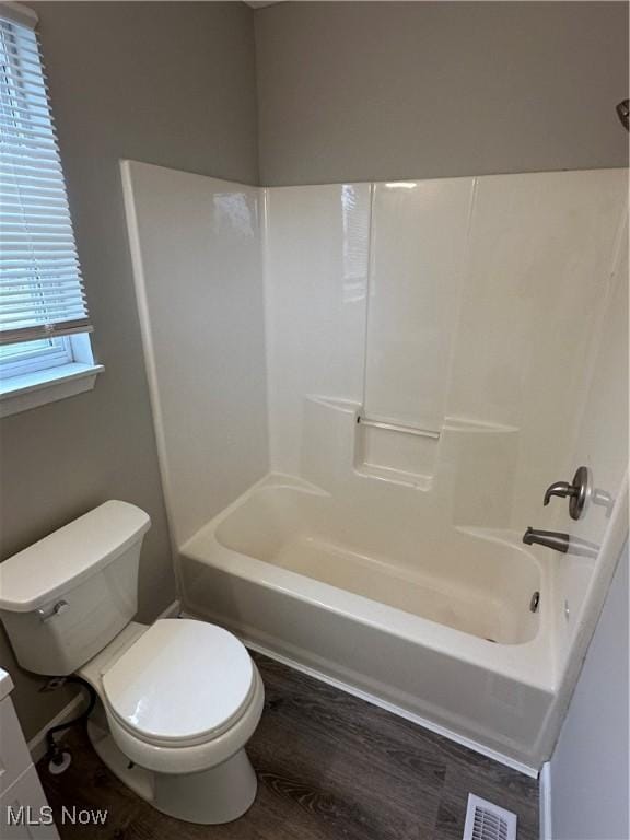 4225 E 93rd St, Cleveland, OH 44105 - bathroom featuring toilet, shower / bath combination, and wood finished floors
