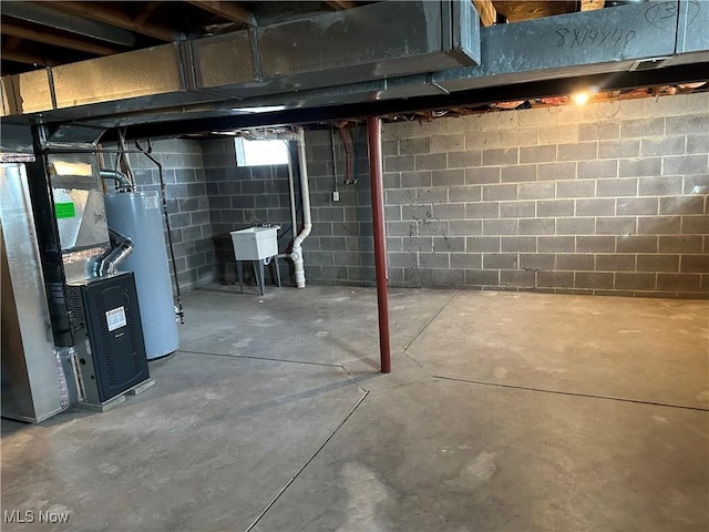 unfinished below grade area featuring a sink, heating unit, and gas water heater