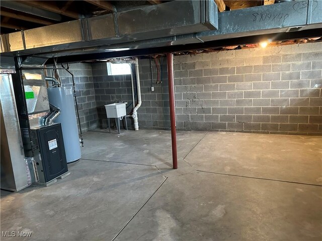 4225 E 93rd St, Cleveland, OH 44105 - unfinished below grade area with water heater, a sink, and heating unit
