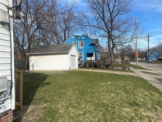 4225 E 93rd St, Cleveland, OH 44105 - view of green lawn with an outdoor structure and a garage