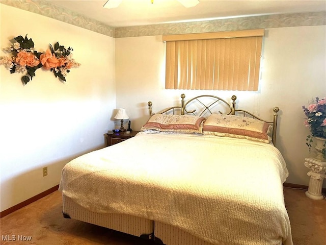 bedroom with carpet, baseboards, and a ceiling fan