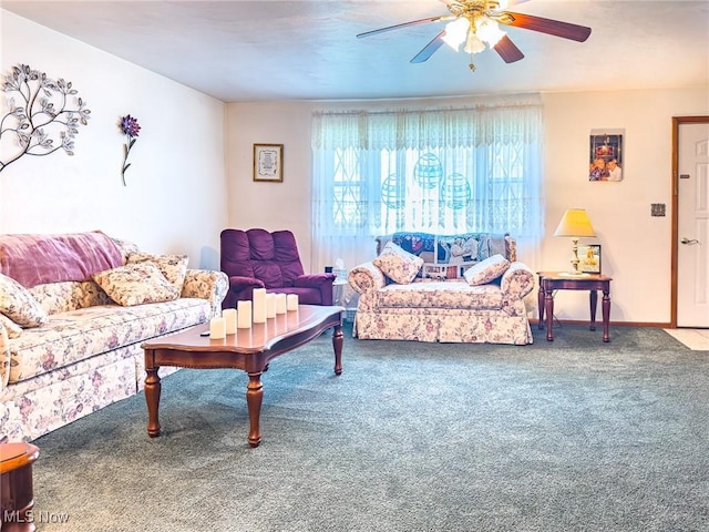 living room featuring baseboards, carpet, and a ceiling fan