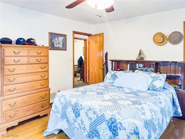 bedroom featuring ceiling fan and wood finished floors