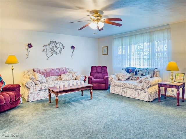 carpeted living room featuring a ceiling fan