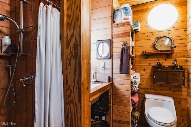 1000 Coon Fork Rd, Arnoldsburg, WV 25234 - bathroom featuring wood walls, a tile shower, and toilet